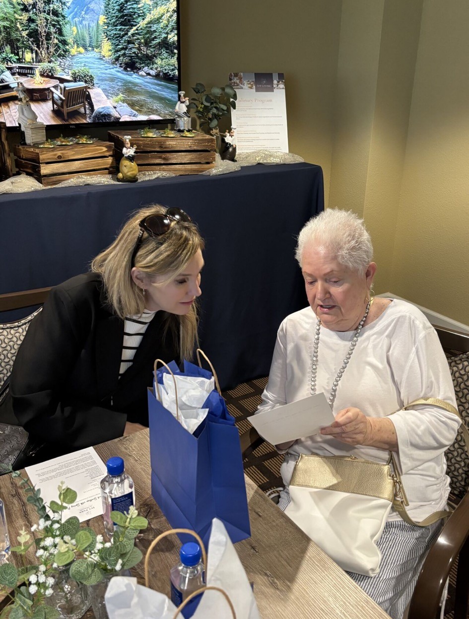 Marnie Giorgi helping a senior during a senior living tour