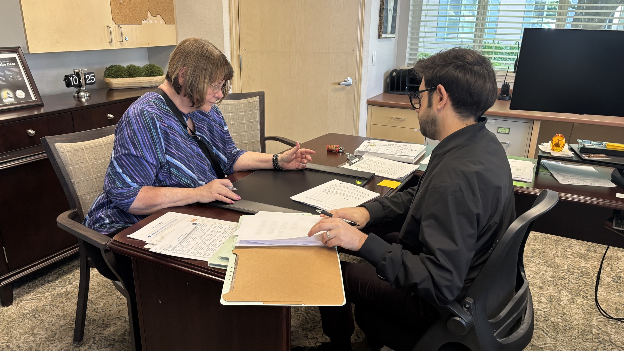 A senior living consultation with a resident and community staff