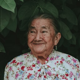 A senior woman enjoying a tour of a senior living community